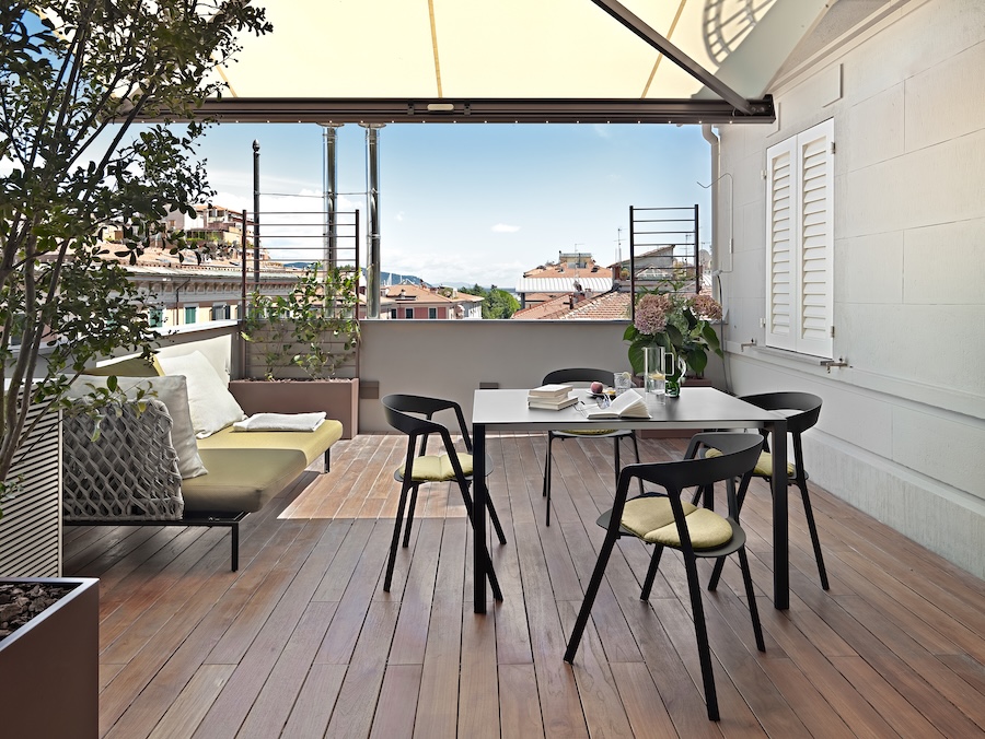 modern dining table and the sofa in the terrace 2026 03 17 20 05 20 utc 1